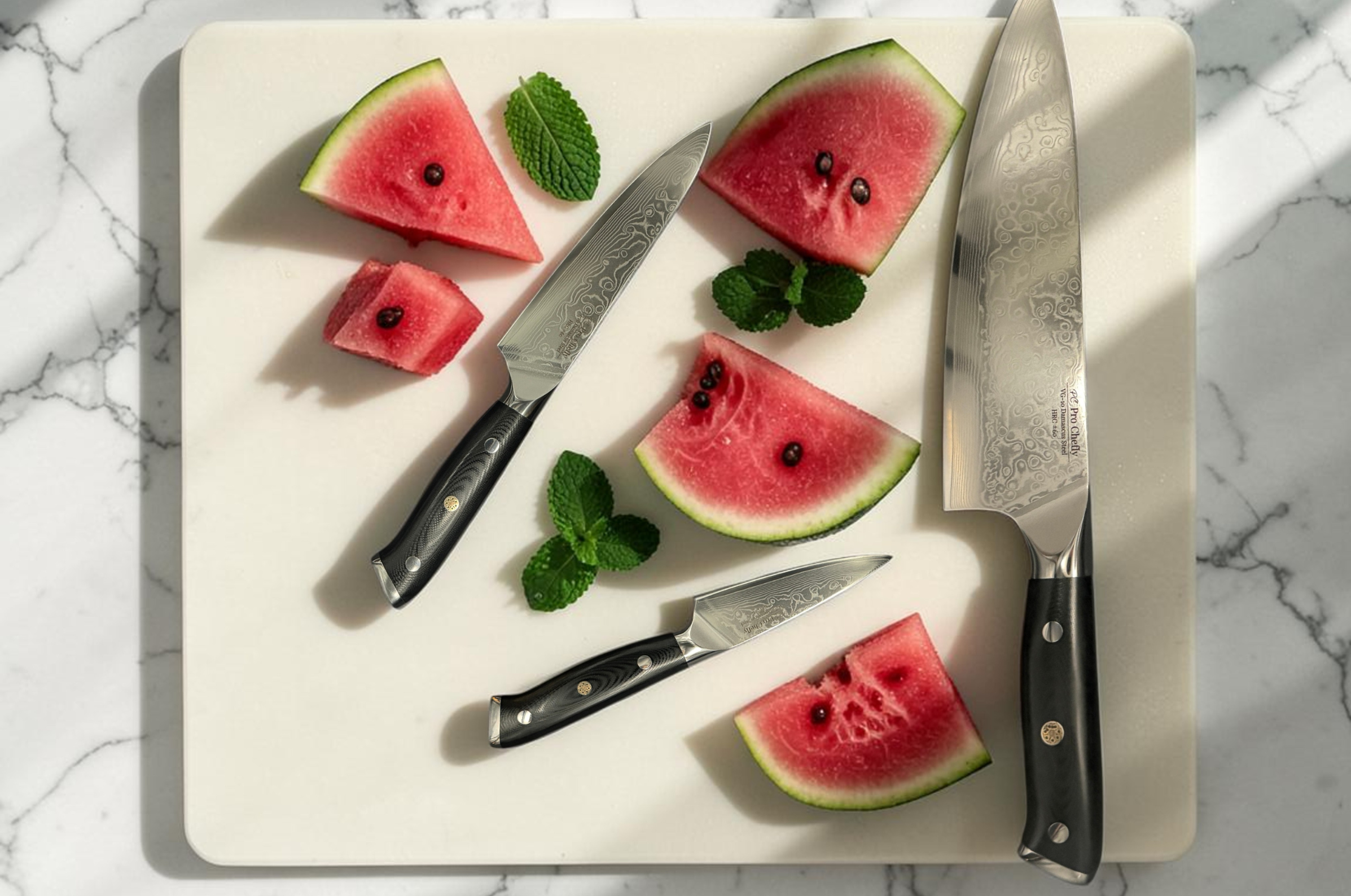 Image of Pro Chefly Damascus steel kitchen knives displayed with fresh watermelon slices and mint on a cutting board.
