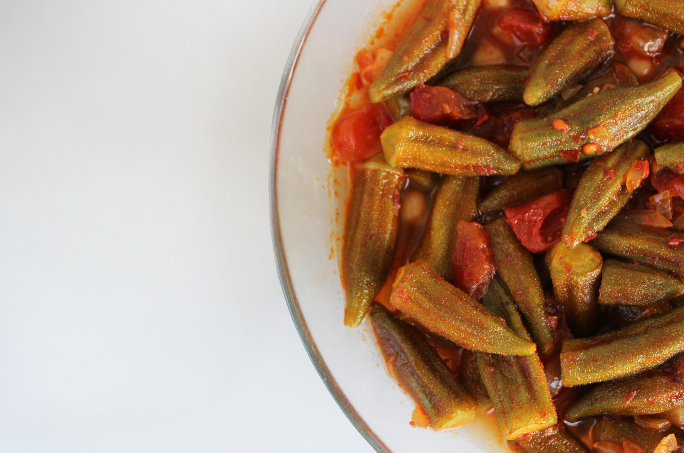 Image of Pro Chefly okra recipe with tender okra simmered in a rich tomato sauce with onions and peppers.