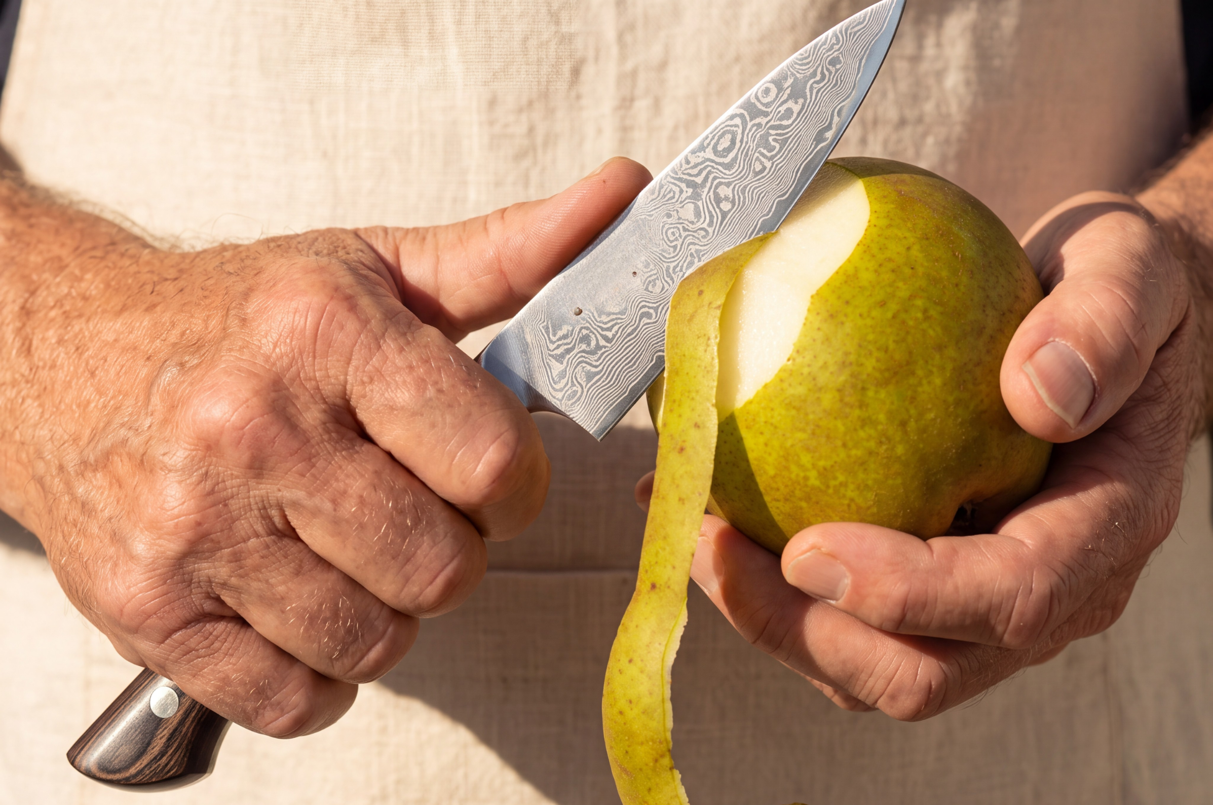Image of Pro Chefly Damascus paring knife peeling a fresh green pear with precision.