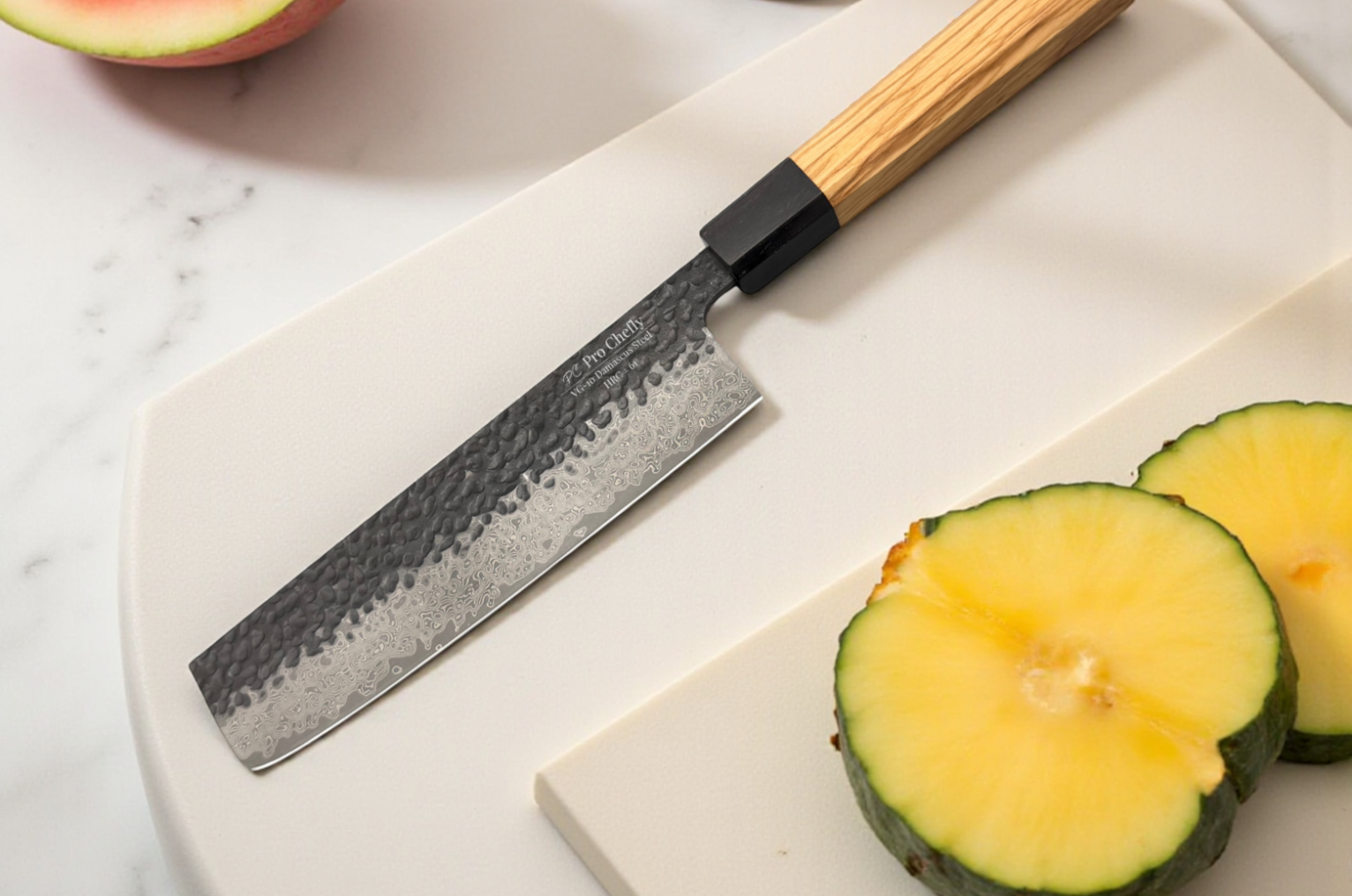 Image of Pro Chefly Japanese Damascus nakiri knife with a hammered blade and light wood handle resting on a white cutting board