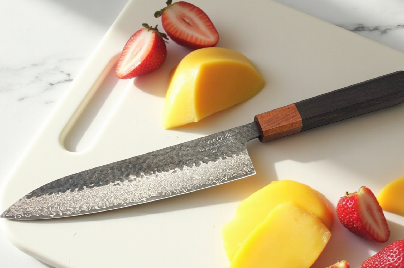 Image of Pro Chefly Japanese Damascus gyuto knife on a white cutting board with sliced mango and strawberries, showcasing razor-sharp precision, blade detail, and clean fruit prep in bright natural lighting