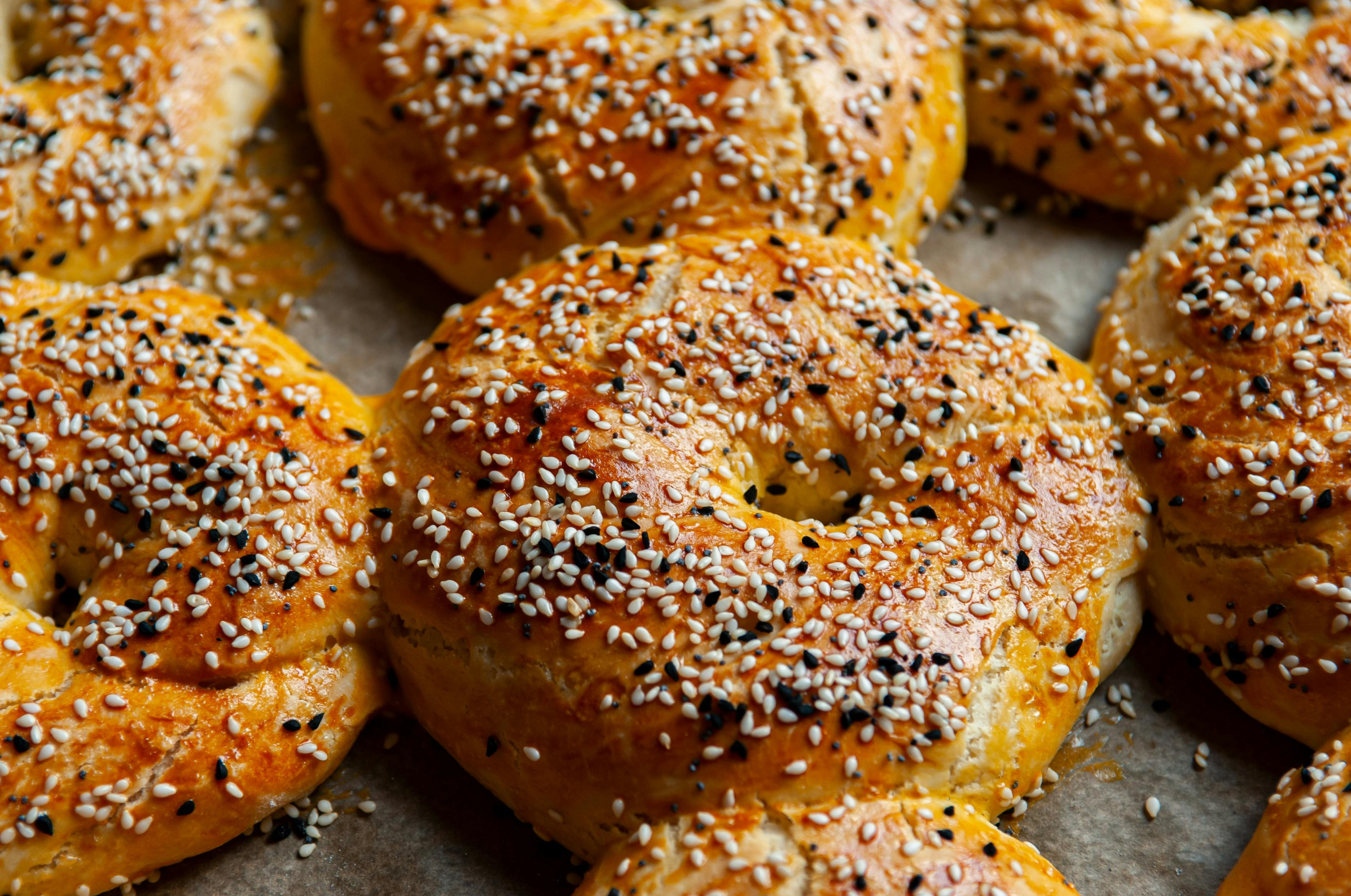 Image of Pro Chefly homemade everything bagels with golden crust, sesame and black seed topping, baked to a glossy finish for classic chewy texture and artisan bread quality