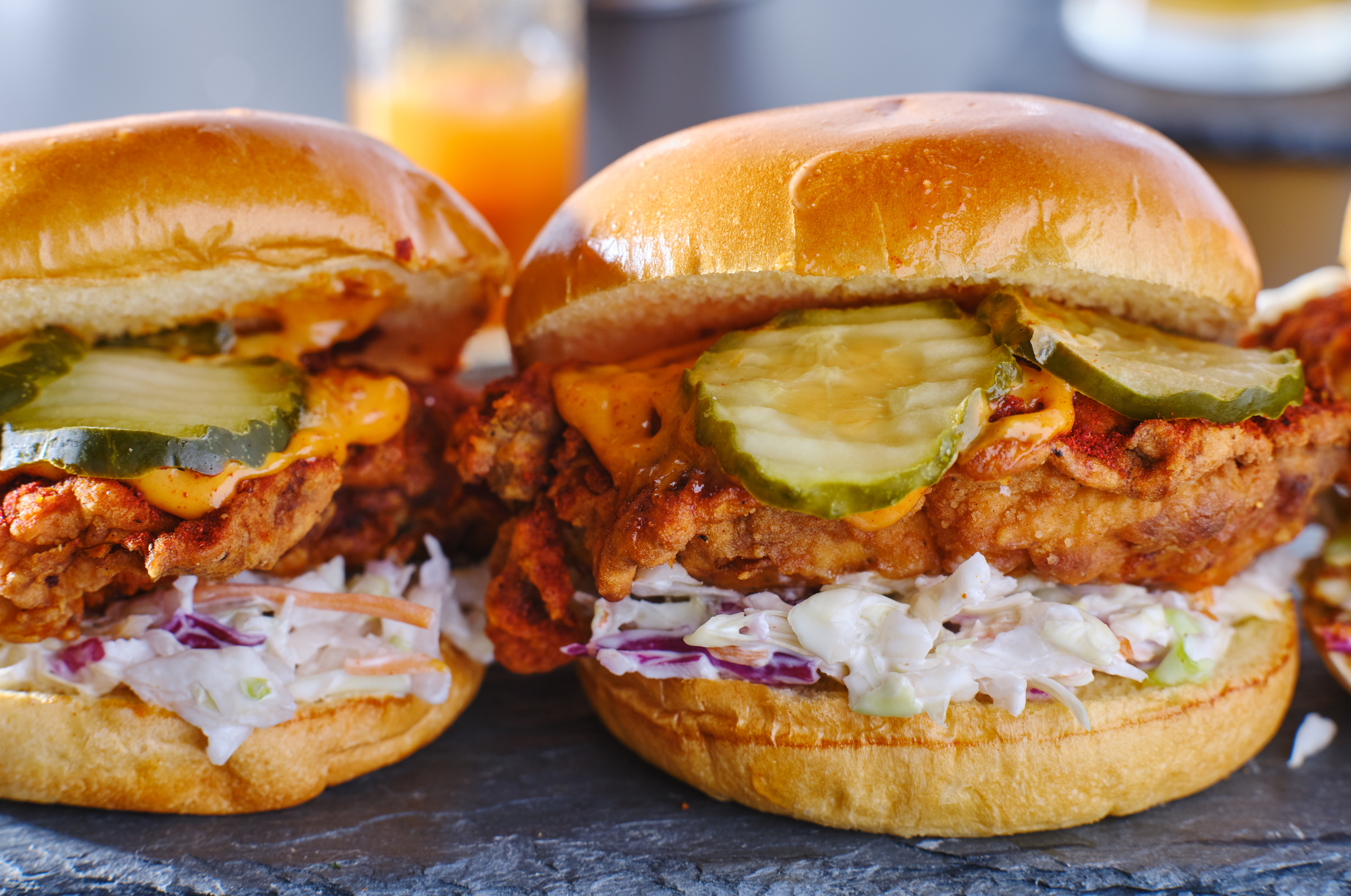 Image of Pro Chefly crispy fried chicken sandwiches with pickles, slaw, and toasted brioche buns, showcasing bold crunch and indulgent comfort food appeal