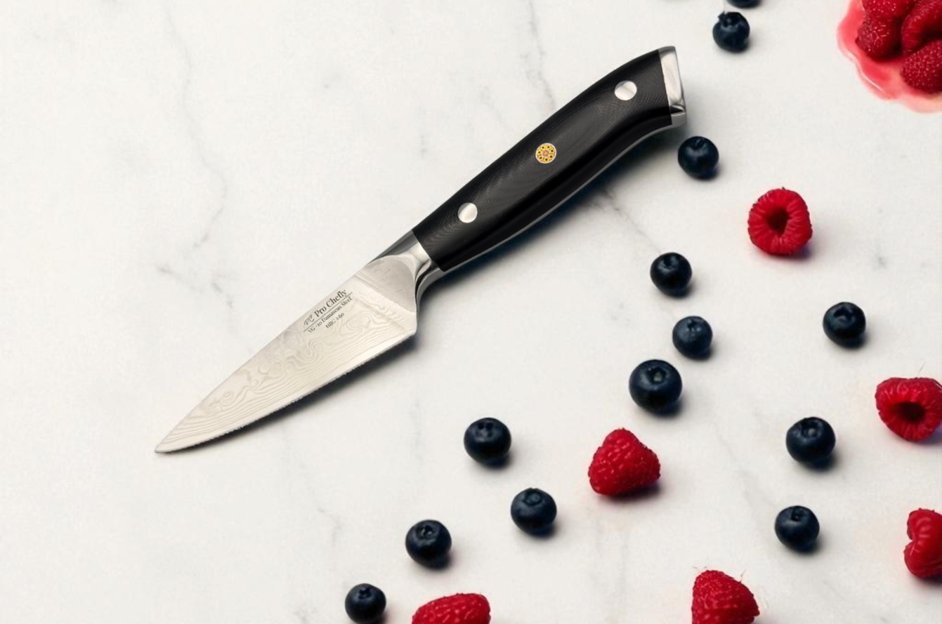Image of Pro Chefly Damascus paring knife on white marble with fresh berries, showcasing VG-10 steel and precision craftsmanship.