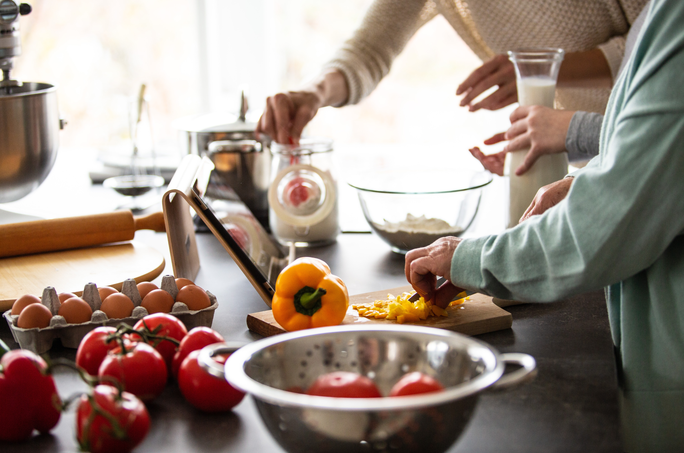 Image of Pro Chefly Japanese Damascus knife in action during home cooking prep, slicing fresh vegetables with precision, craftsmanship, and everyday kitchen confidence.