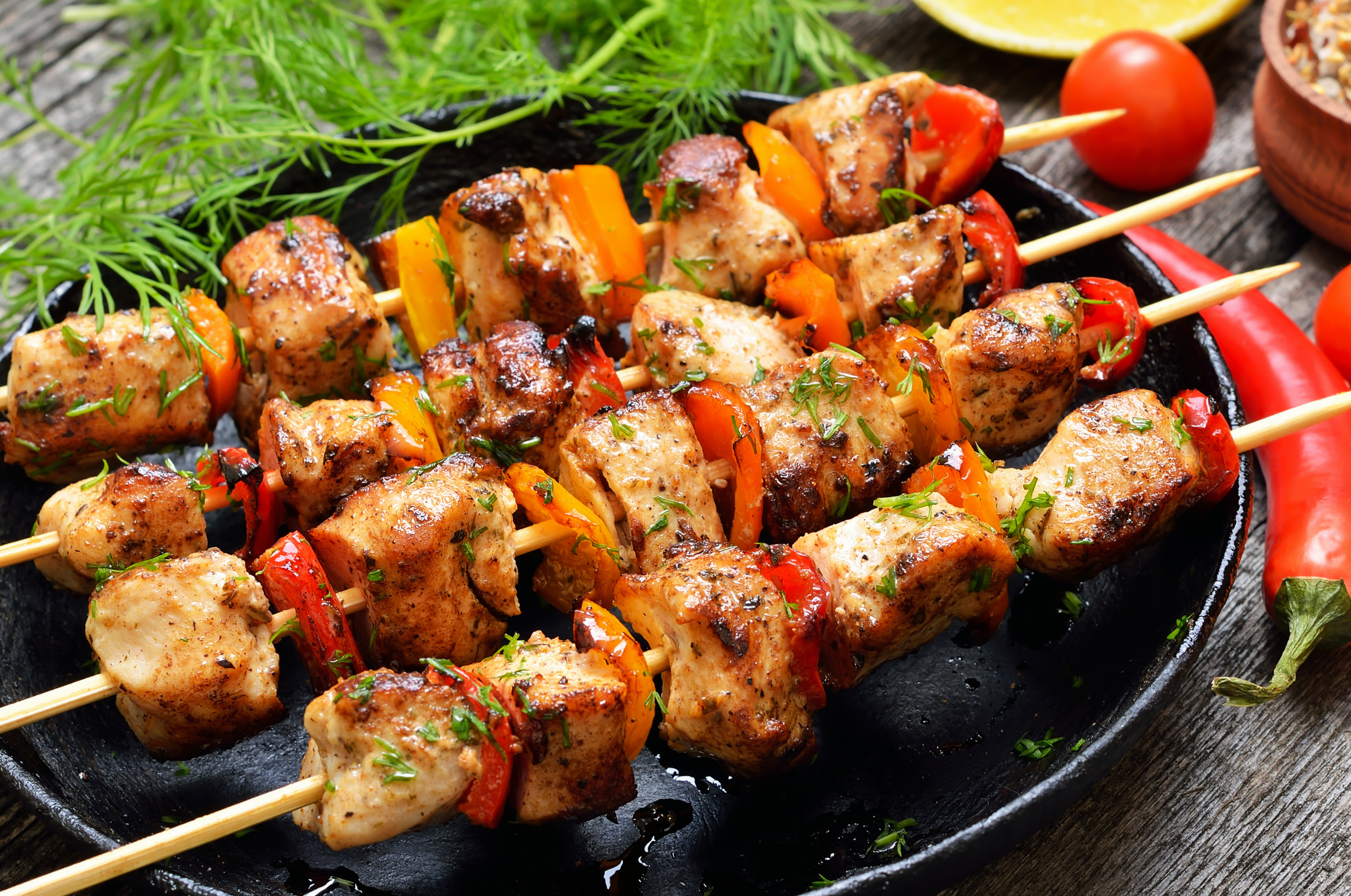 Image of Pro Chefly grilled pork kebabs with bell peppers, lightly charred and finished with fresh herbs for an easy summer meal.