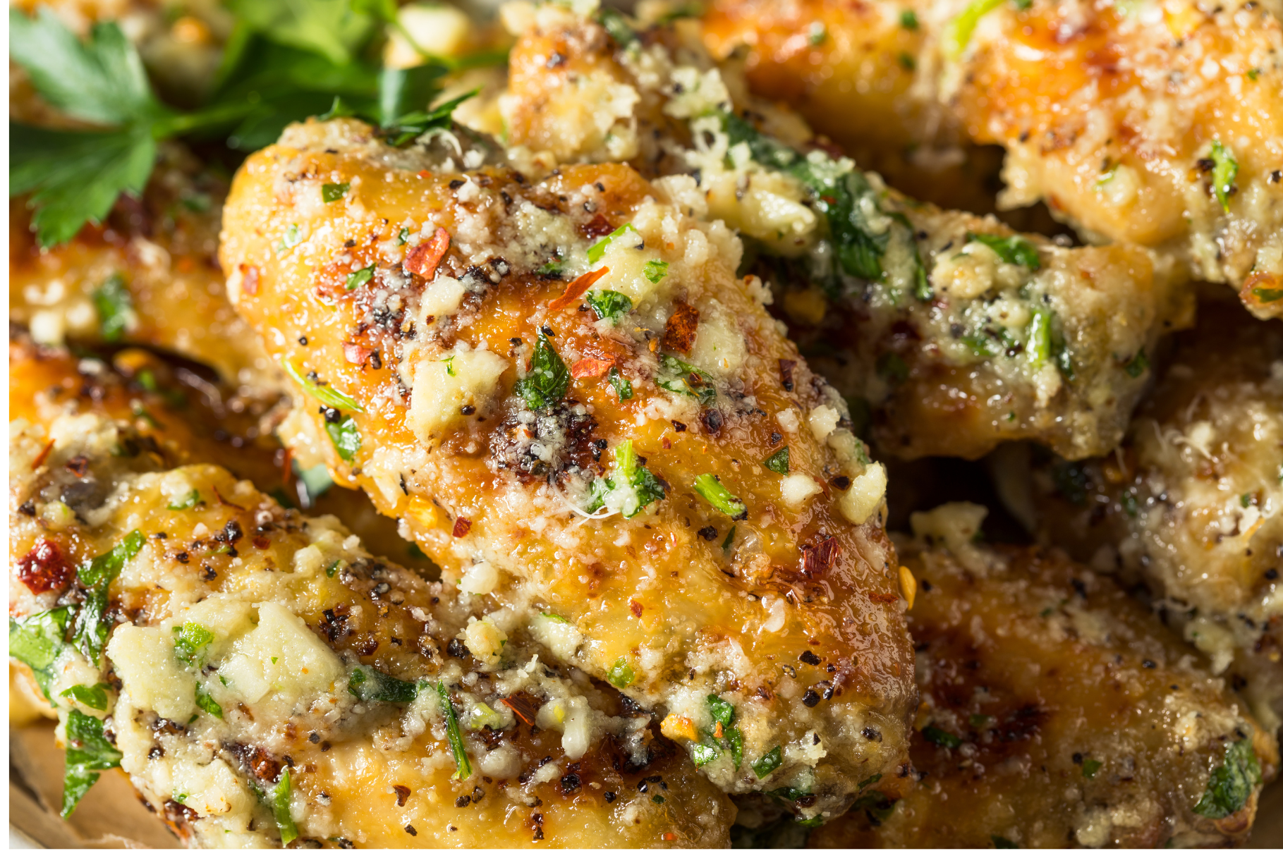 Image of Pro Chefly garlic parmesan chicken wings coated in fresh herbs, cheese, and seasoning, showcasing bold flavor and perfect crispy texture.