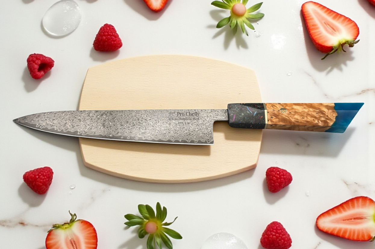**Alt text:** Pro Chefly Damascus chef knife on a wooden board with strawberries and raspberries on a marble surface.
