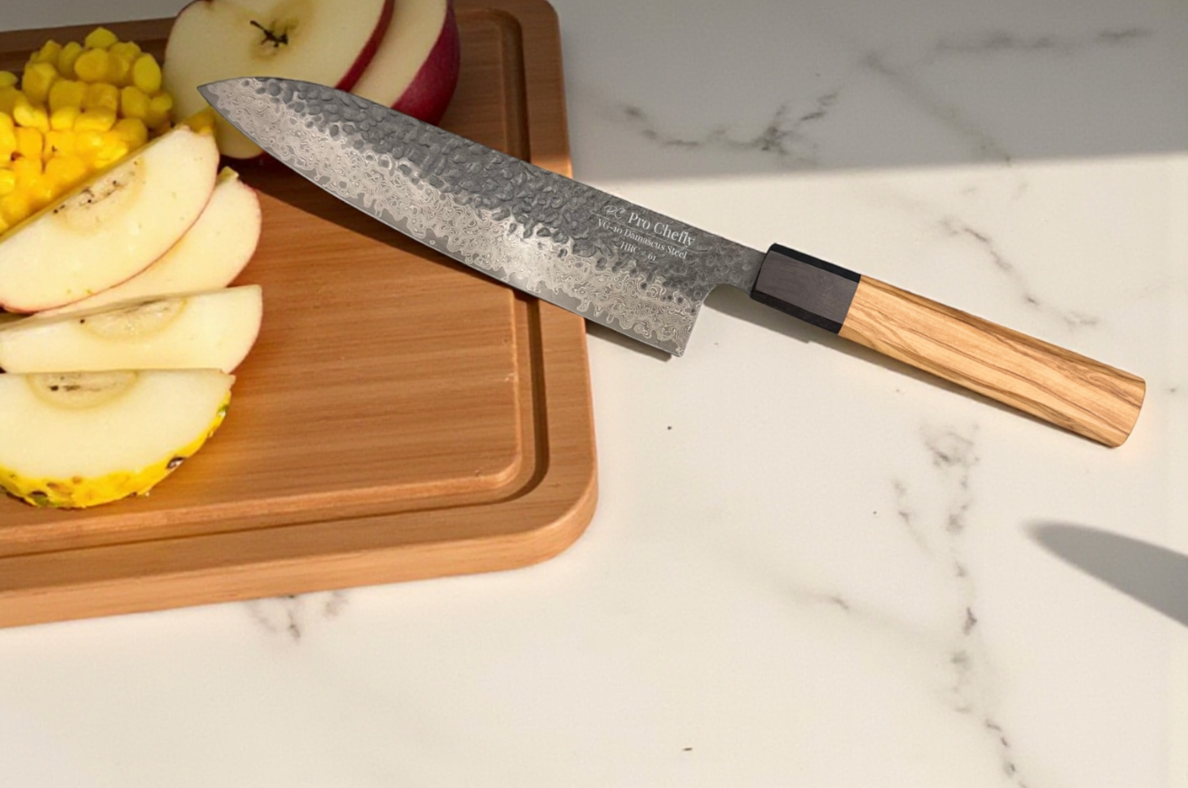 Pro Chefly Damascus chef knife on a marble counter beside sliced apples and corn on a wooden board.