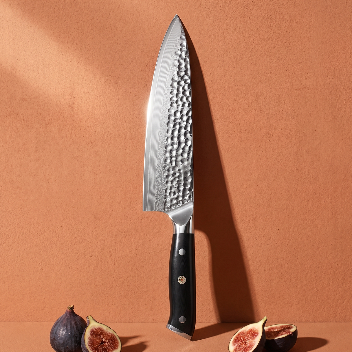 Pro Chefly 8-inch Damascus chef knife with black triple-riveted handle, standing against a terracotta wall with fresh figs