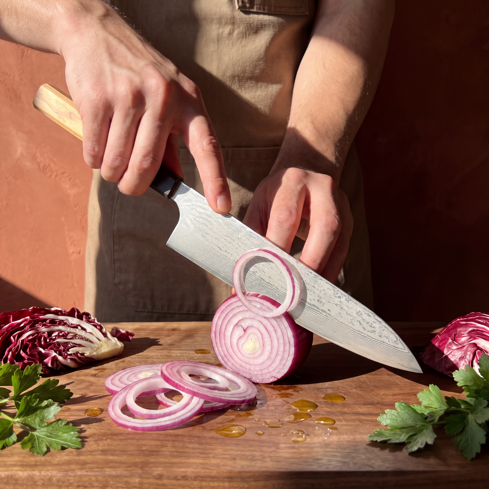 Pro Chefly 9-inch Damascus gyuto chef knife with olivewood wa handle, slicing red onion rings on a walnut board