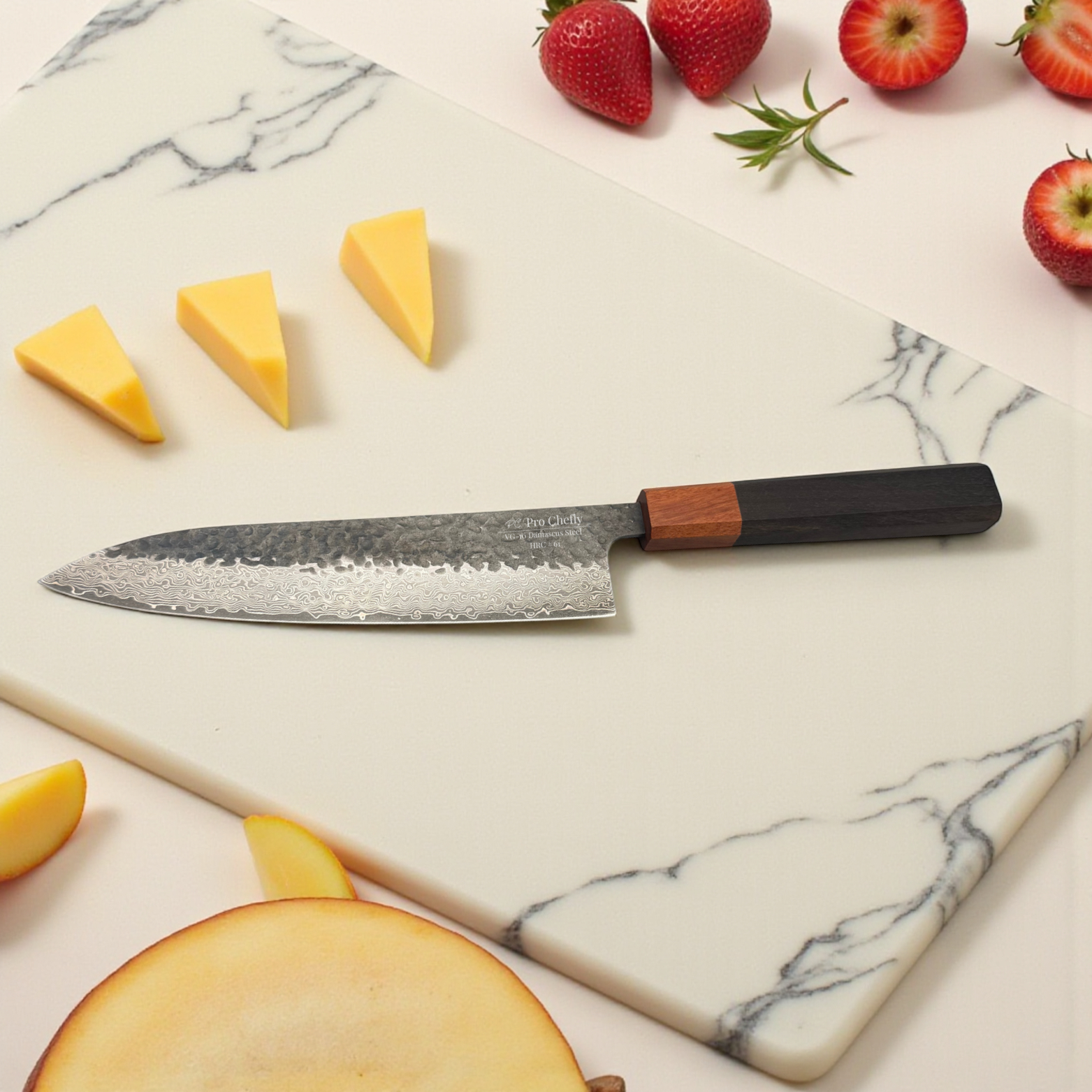 Image of Pro Chefly VG-10 Damascus steel Japanese chef knife with pakkawood handle on marble surrounded by sliced mango wedges and strawberries.