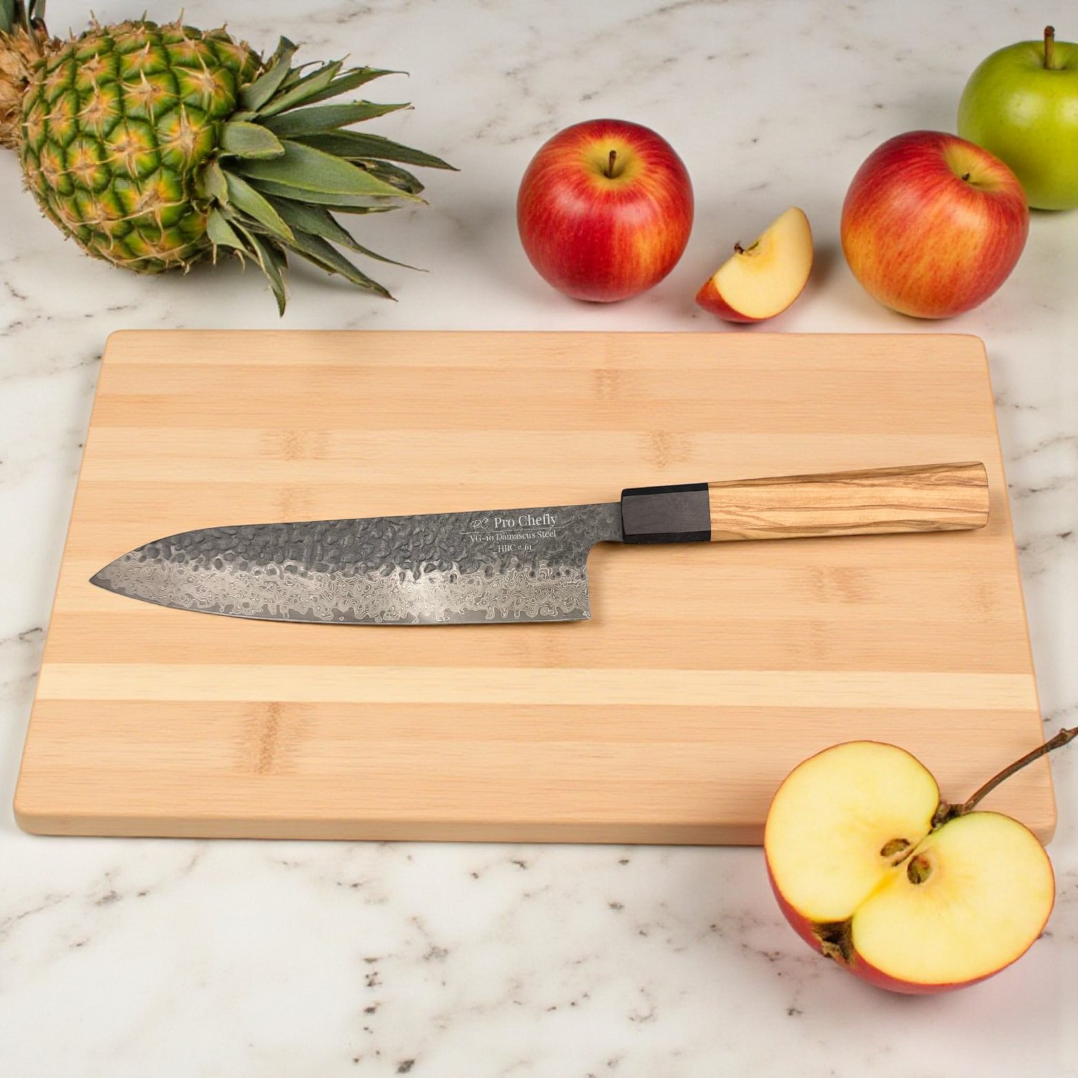 Image of Pro Chefly VG-10 Damascus steel Japanese chef knife with olivewood handle on cutting board with pineapple and apples.