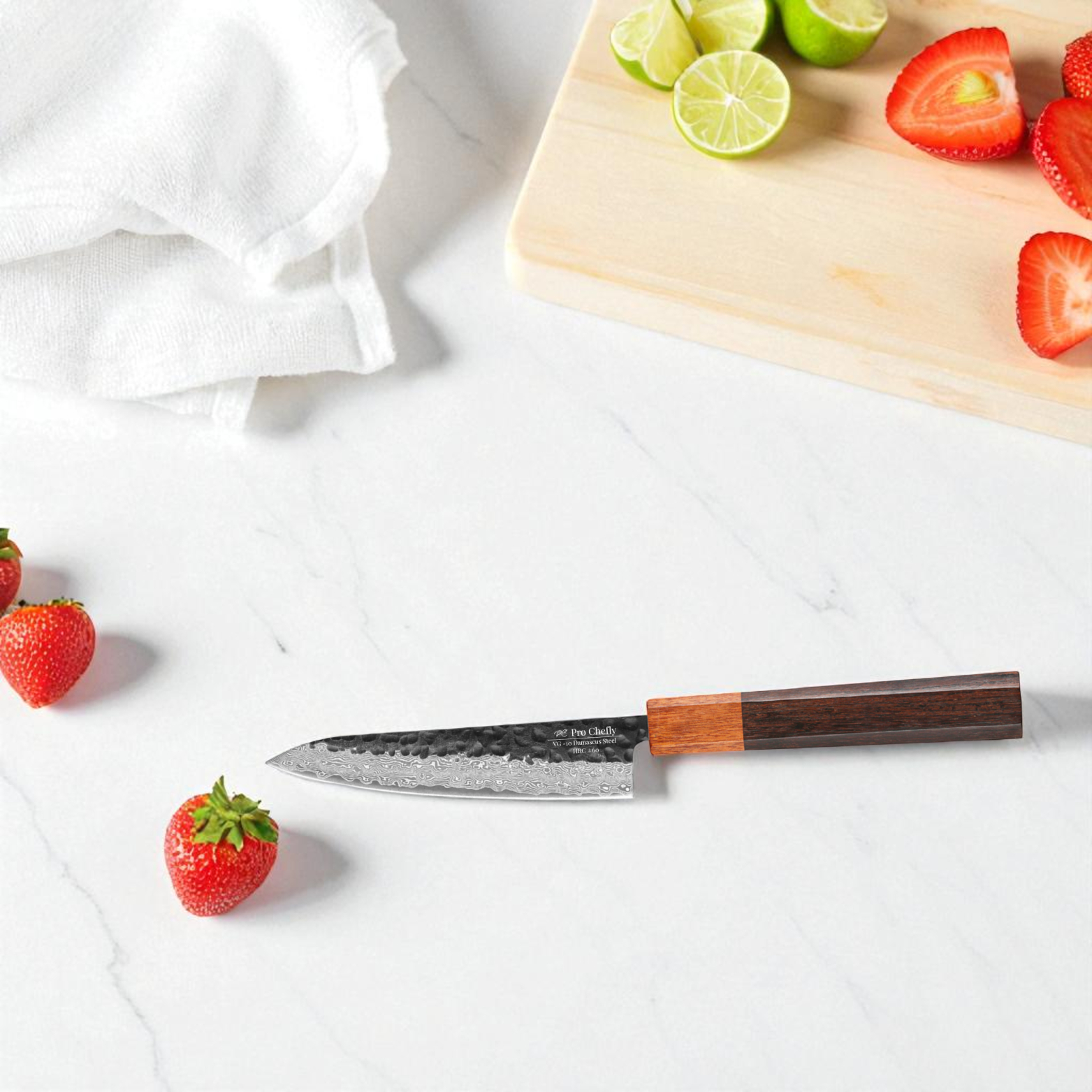 Image of Pro Chefly VG-10 Damascus steel Japanese petty knife with rosewood handle surrounded by sliced strawberries and lime.
