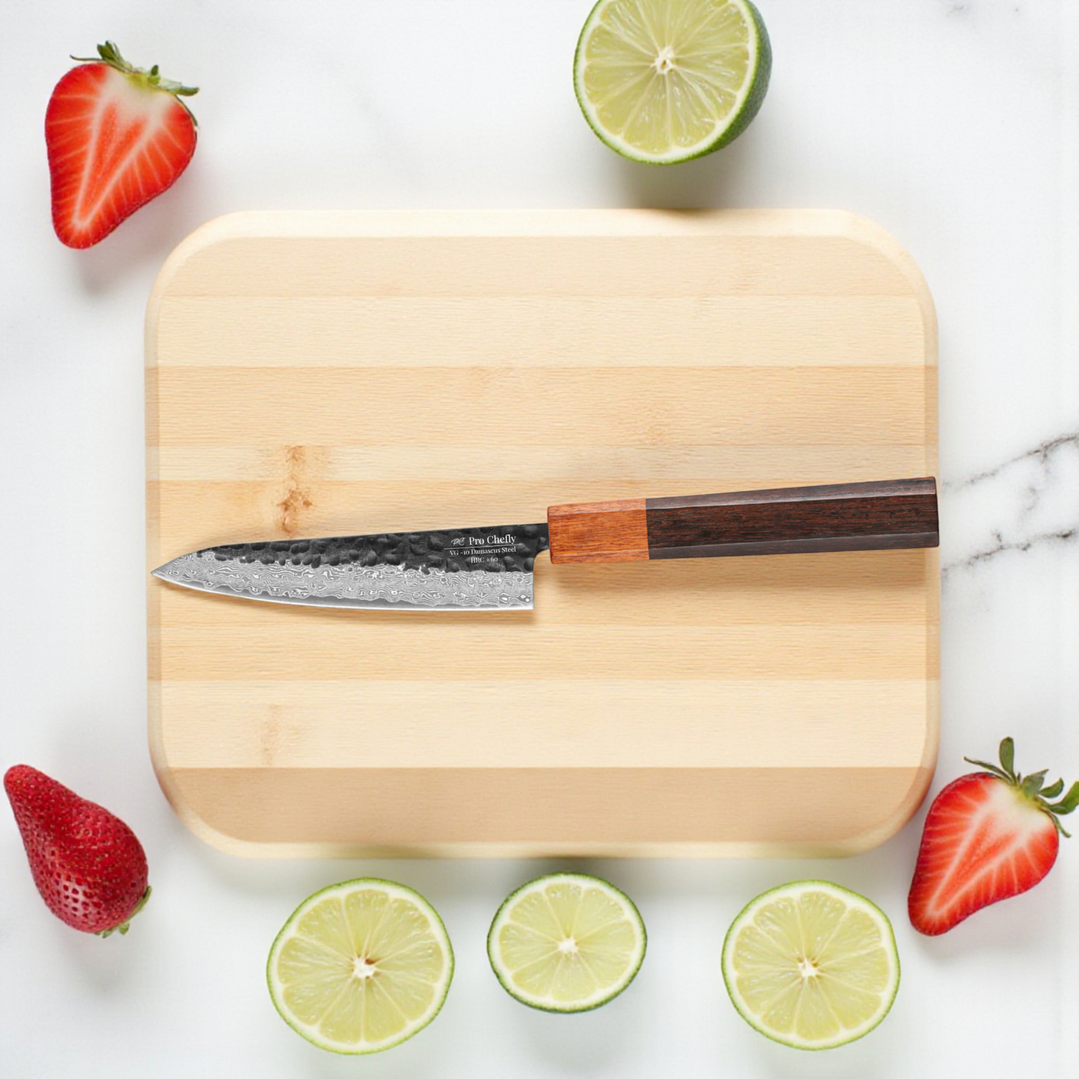 Image of Pro Chefly VG-10 Damascus steel Japanese petty knife with rosewood handle on cutting board surrounded by sliced strawberries and lime pieces.