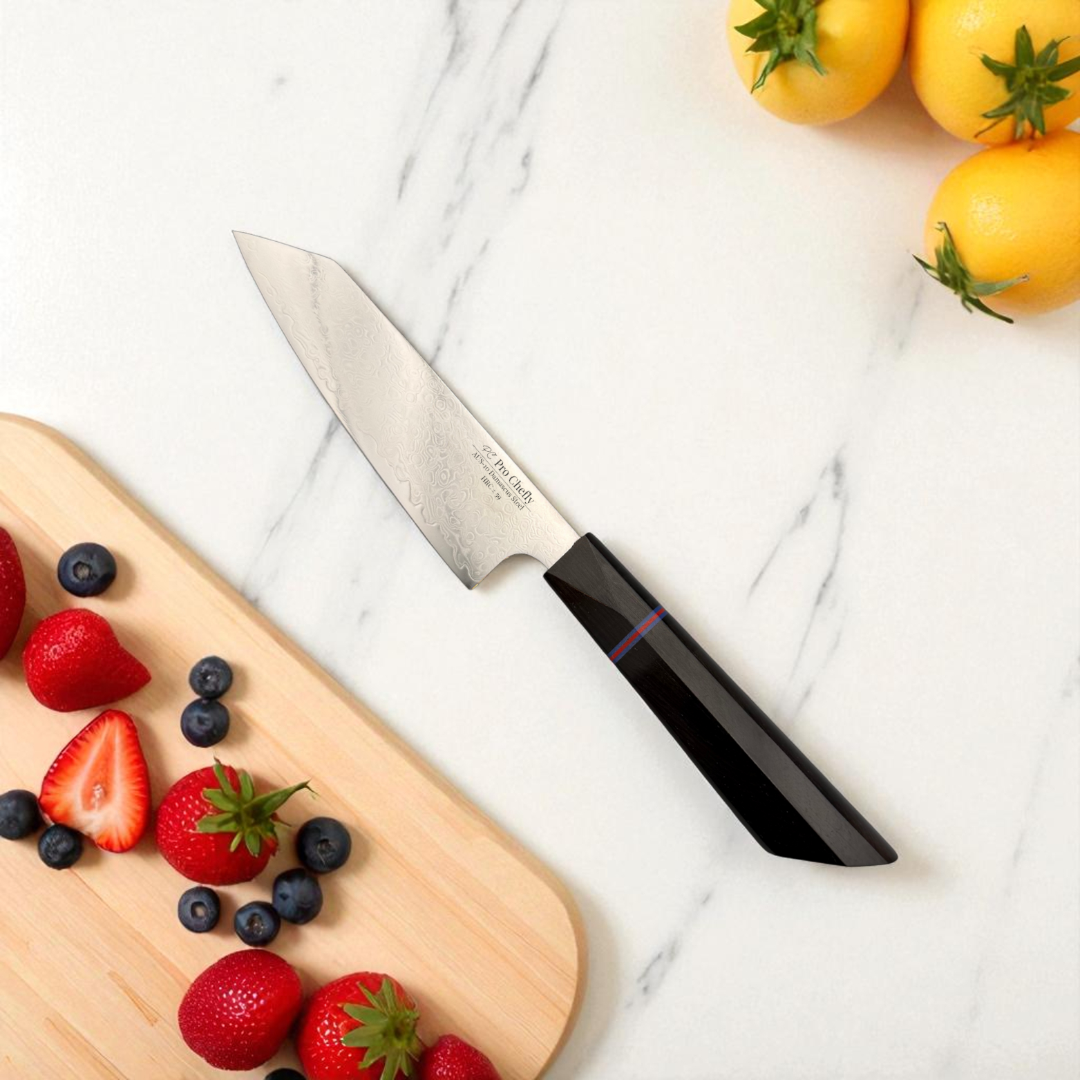 Image of Pro Chefly AUS-10 Damascus steel Japanese petty knife beside strawberries and yellow tomatoes on marble.