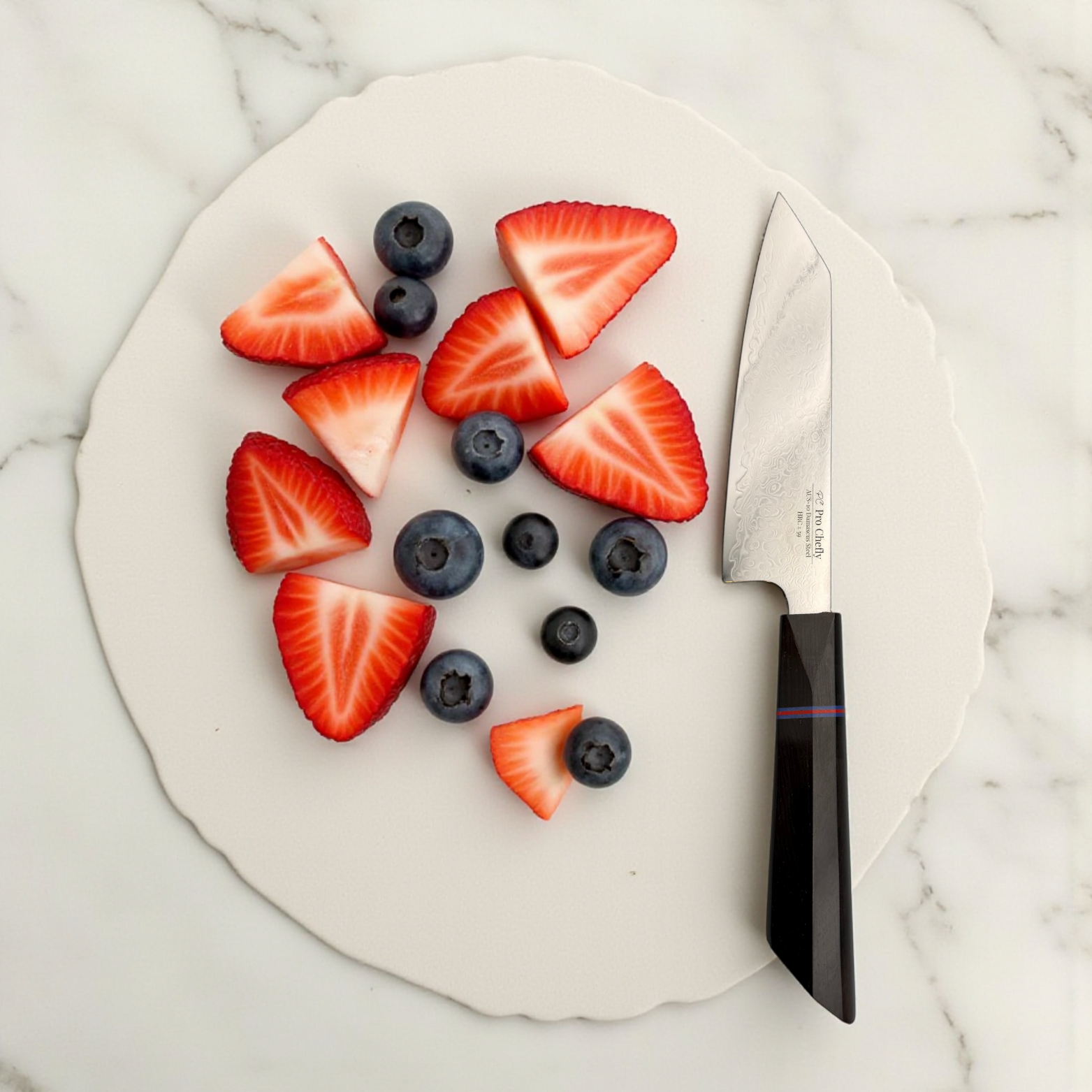 Image of Pro Chefly AUS-10 Damascus steel Japanese petty knife next to sliced strawberries and blueberries on white plate.