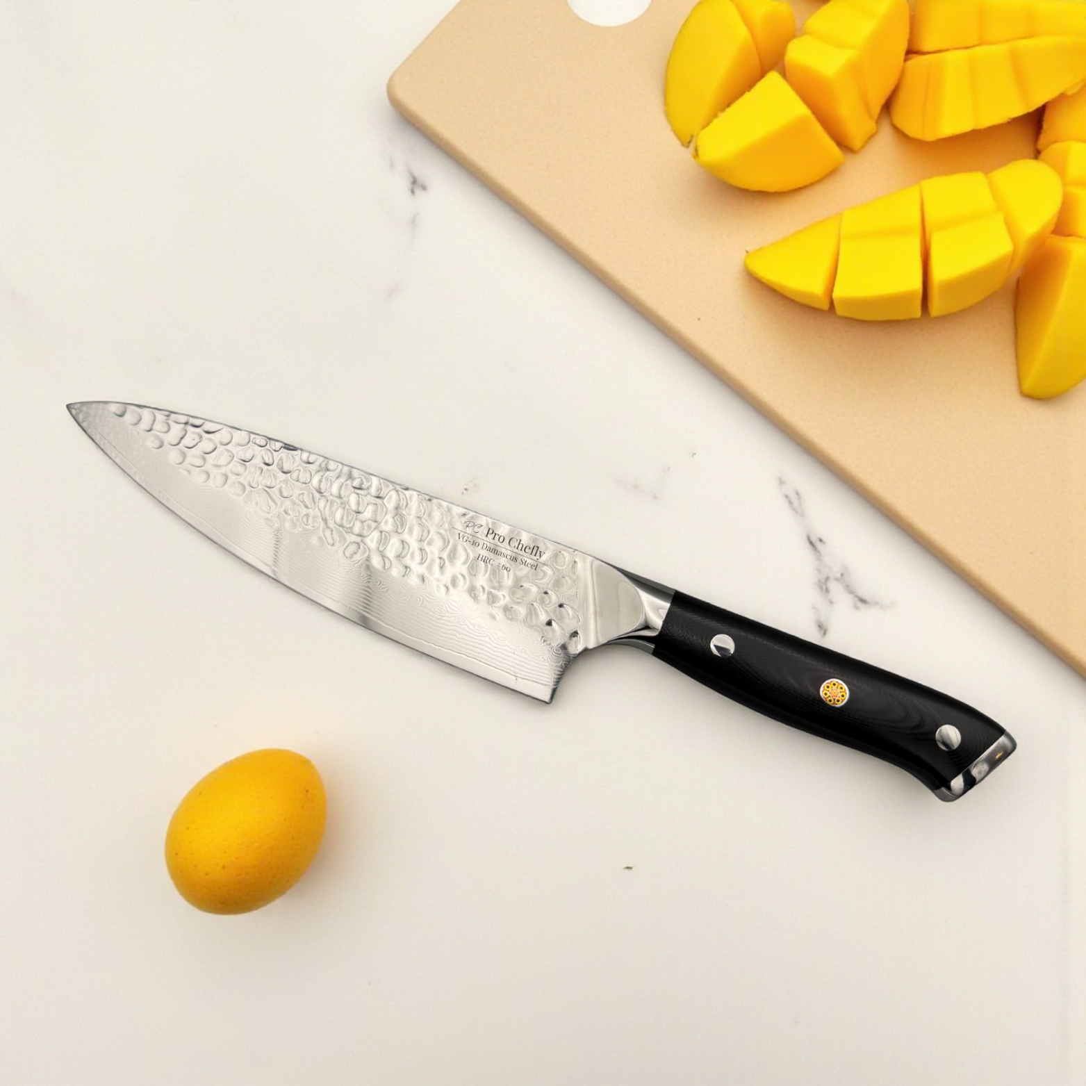 Image of  Pro Chefly VG-10 Damascus steel Japanese chef knife with triple-riveted G-10 handle beside diced mango cubes on marble surface.