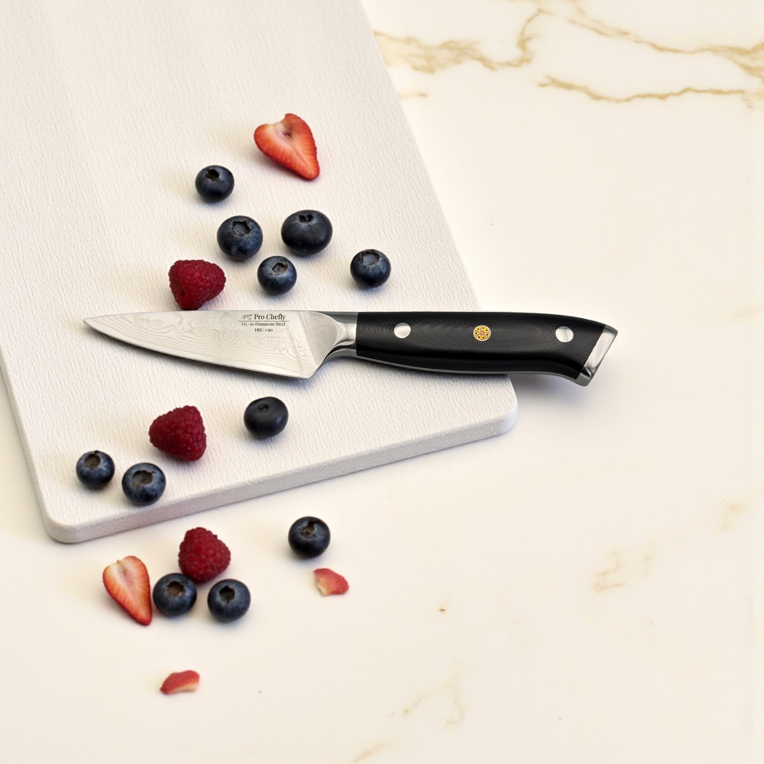 Image of Pro Chefly VG-10 Damascus steel Japanese paring knife with G10 fiberglass handle surrounded by blueberries and strawberries on marble.