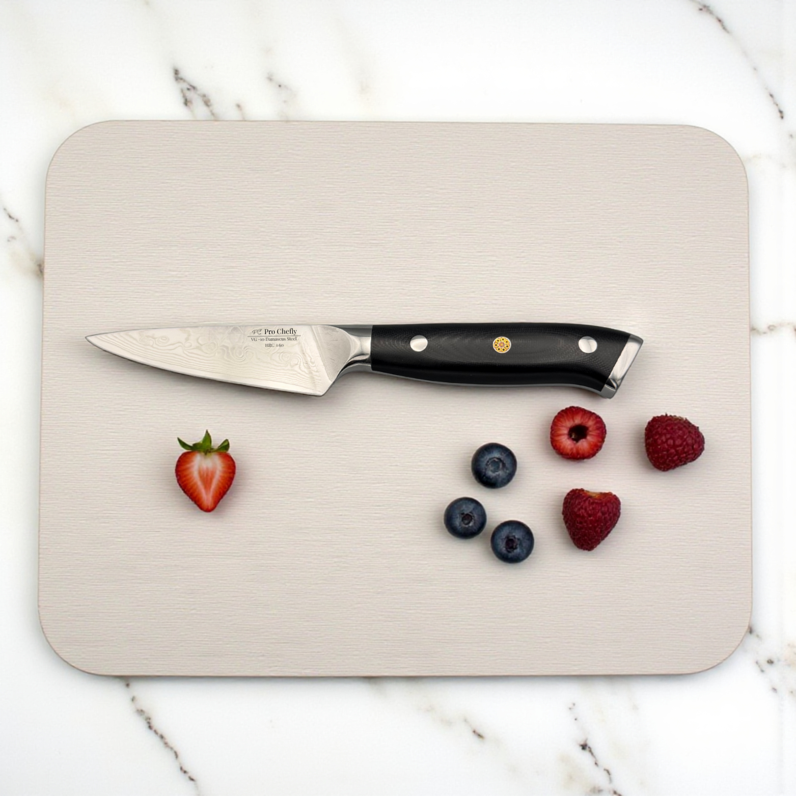 Image of Pro Chefly VG-10 Damascus steel Japanese paring knife with G10 fiberglass handle on wooden cutting board with berries.