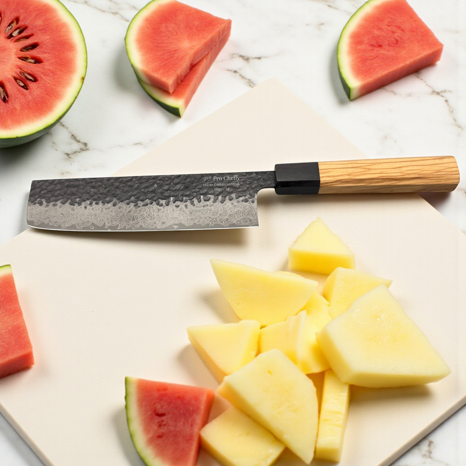 Image of Pro Chefly VG-10 Damascus steel Japanese nakiri knife with olivewood handle surrounded by watermelon and pineapple chunks.