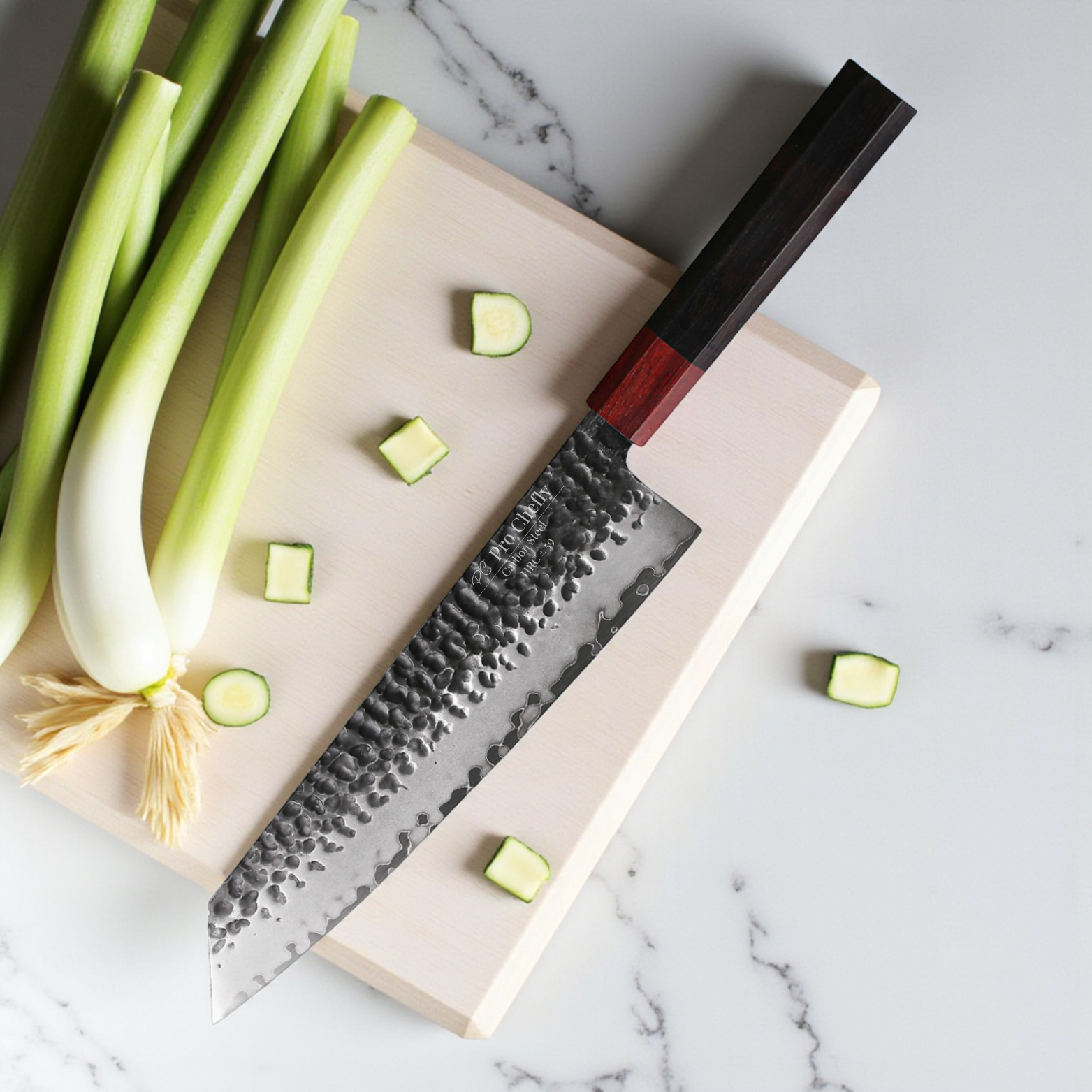 Image of Pro Chefly 3-ply carbon steel Japanese kiritsuke knife with 440C core and pakka wood octagon handle on cutting board with chopped zucchini and leeks.