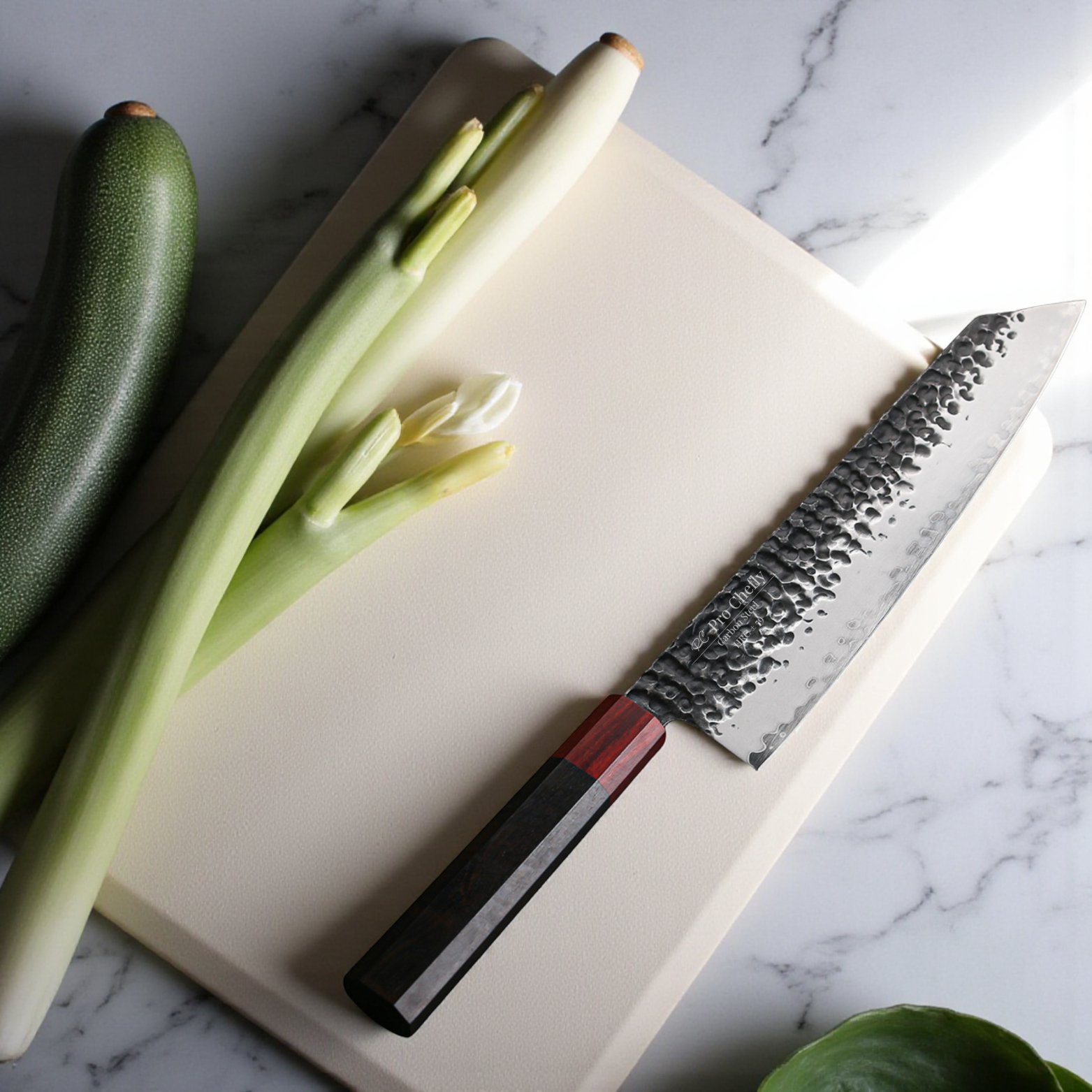 Image of Pro Chefly 3-ply carbon steel Japanese kiritsuke knife with 440C core and pakka wood octagon handle beside zucchini and leeks on a cutting board.