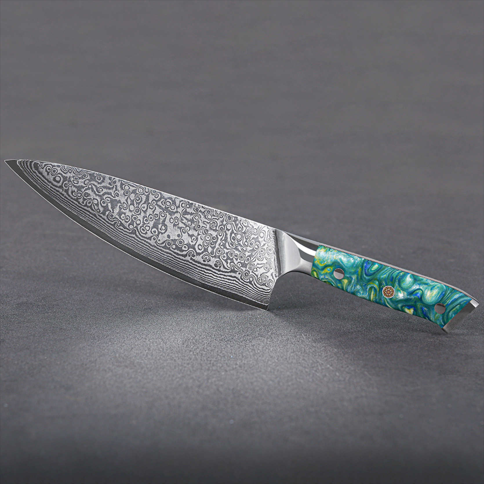 Image of Pro Chefly VG-10 Damascus steel Japanese chef knife with resin handle displayed horizontally on light background.